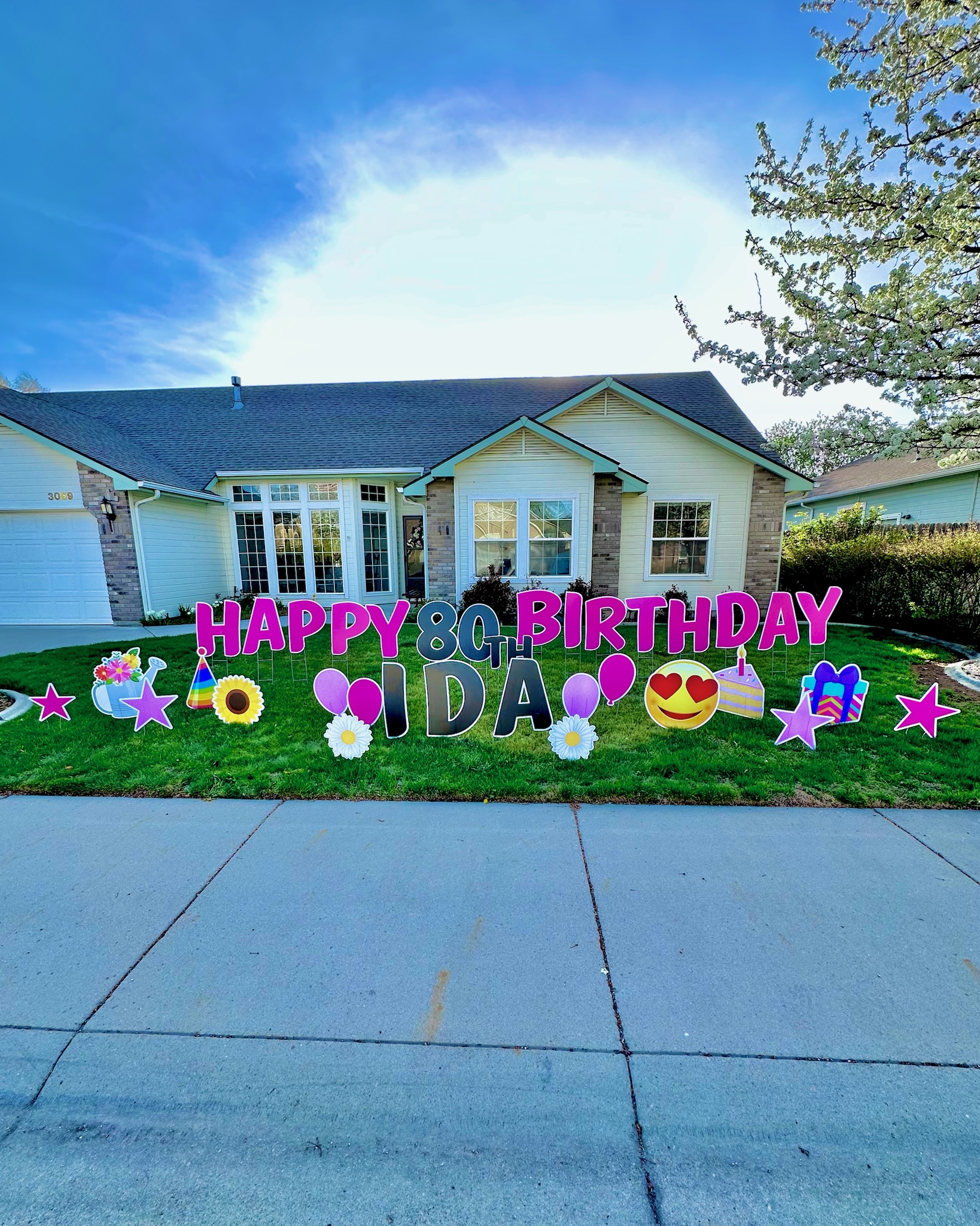 Happy 80th Birthday Ida yard card display with large colorful letters and birthday art in Boise Idaho