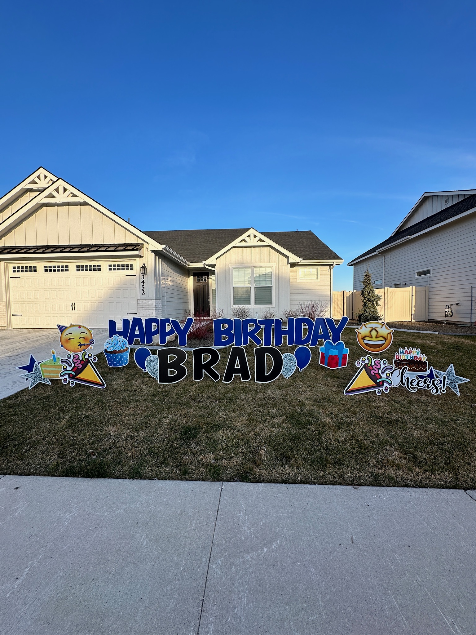 Happy Birthday Brad yard card display with festive letters and celebration art on a Boise Idaho lawn