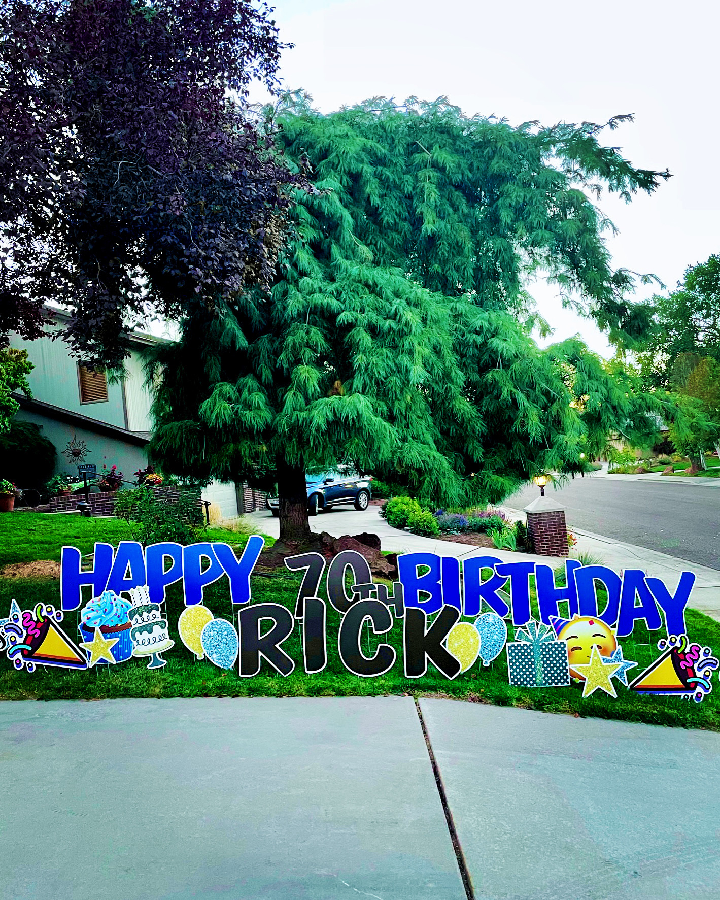 Happy 70th Birthday Rick yard card display with milestone letters and celebration art in Boise Idaho