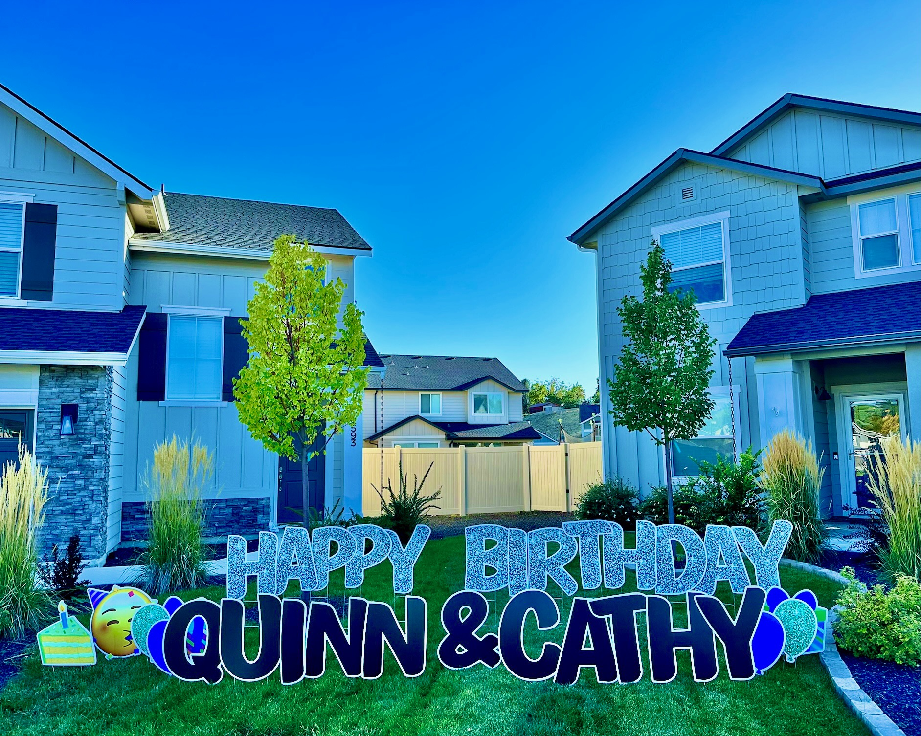 Happy Birthday Quinn and Cathy double name yard card display with colorful letters and art in Boise Idaho