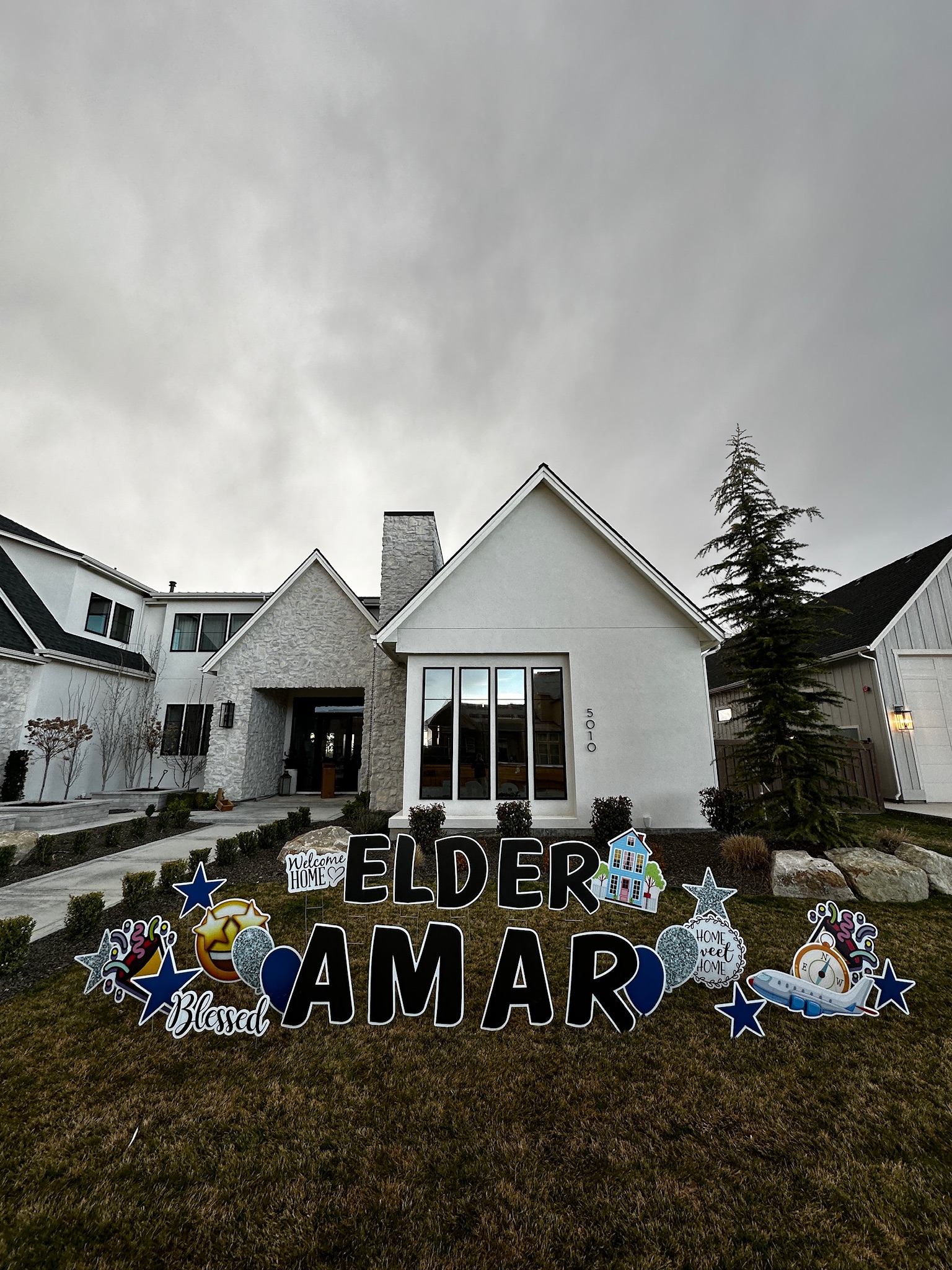 Welcome Home Elder Amar missionary homecoming yard card display with large letters in Boise Idaho