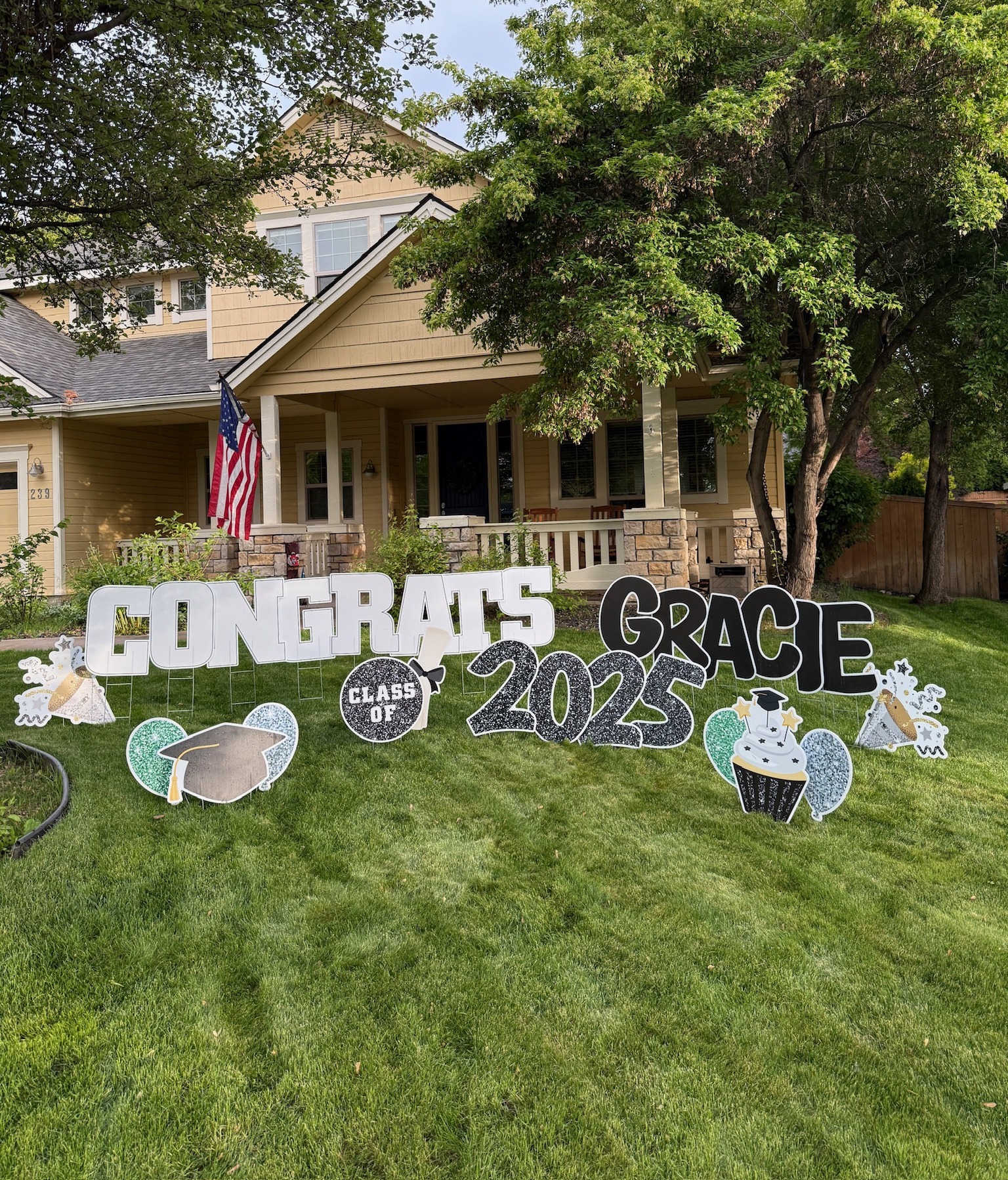 Congrats Gracie Class of 2025 graduation yard card display with white glitter letters and celebration art in Boise Idaho